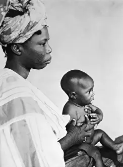 Nigeria Prints: Mother Holding Infant Child