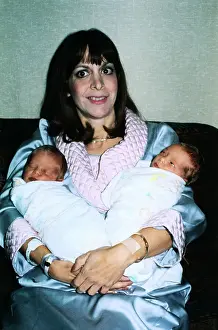 Newborn Prints: Mother Holding Her Test Tube Twins