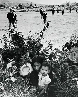 Mother and Son Hiding in Bushes