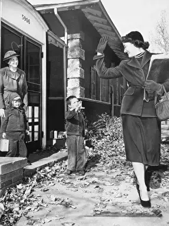 Baby Girl Prints: Mother waving to son (6-7 years) in kindergarten. November 14. 1940