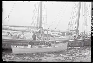 Motorboat Sitting Next to a Schooner