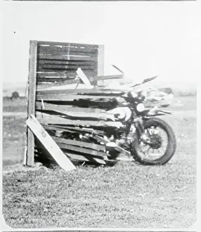 Motorcycle Crashing Through Fence