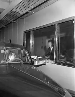 Motorist at Drive-Up Bank Teller Window
