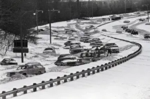 Motorists Dig Out Cars on Snowy Parkway