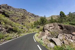 Mountain chain and a country road, El Pie de la Cuesta, Roque Bentaiga, Gran Canaria, Canary Islands, Spain, Europe