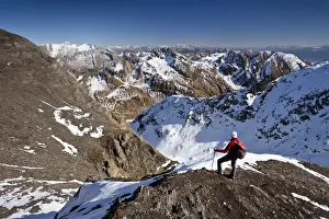 60 64 Years Prints: Mountain climber on the summit ridge while descending from Wilde Kreuzspitze Mountain in the Pfunderer Mountains