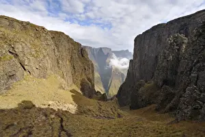 Mountain Pass Prints: Mountain Pass with sharp peak and low lying cloud in background