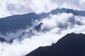 Mountain Peaks Through the Clouds