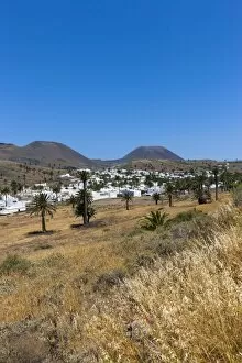 The mountain village of Haria, with its white houses, the volcano Monte Corona at the back, Maguez, Lanzarote