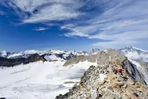 Mountaineers during the descent from Mt Hoher Angelus, Ortler range, mountains Ortler, Koenig and Vertainspitze at back