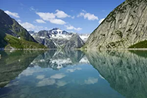 Images Dated 21st July 2013: Mountains around the Grimsel Pass are reflected in Gelmerstausee reservoir, Guttannen