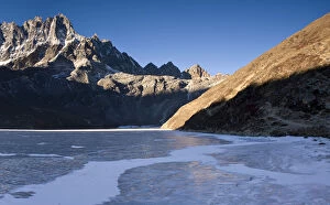 Mountains overlooking frozen valley