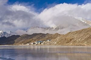 Images Dated 11th February 2011: Mountains and village on rural lake