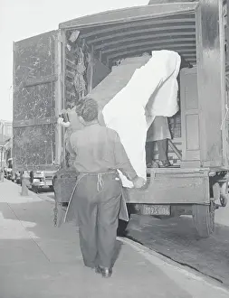 Movers Carrying Sofa