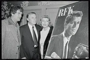 Movie Favorites Standing Near Large Poster