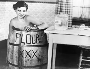 Movie Still of Nude Woman in Flour Barrel