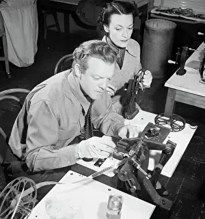 Movie Star Splicing Film with Assistant