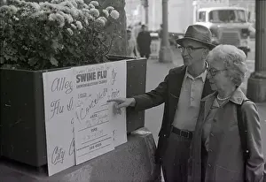 Influenza Prints: Mr. And Mrs. Dorow Point To A Sign