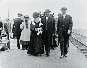 John D Prints: Mr. and Mrs. John D. Rockefeller Sr. Strolling at Train Station