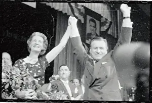 Rochester Prints: Mr and Mrs. Nelson Rockefeller Hold Arms up in Victory