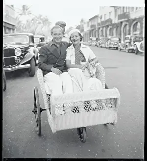 Mr. and Mrs.George Jessel Sitting in a Beach Chair