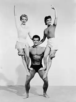 Strong Prints: Mr. Universe Holding Debbie Reynolds and Jane Powell
