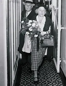 Mrs. Albert Einstein Walking with Bouquet of Flowers