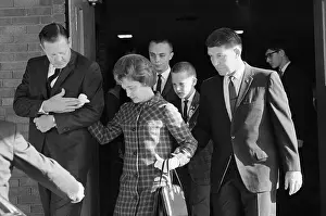 Walter M Prints: Mrs. Betty Grissom Being Escorted