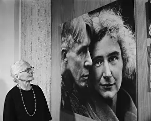 Mrs. Carl Sandburg Looking at a Painting