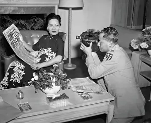 Mrs. Chiang Kai-Shek Holds Paper For Pho