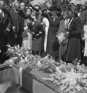 Mourner Prints: Mrs. Mamie Bradley Watches as Her Son is Lowered into the Ground
