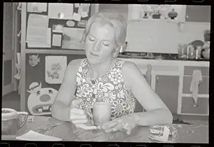 Mrs. Marietta Jaeger Sitting and Holding Cup