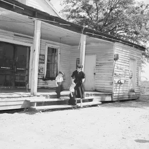 Sumner Prints: Mrs. Roy Bryant Leaving Building with Sons