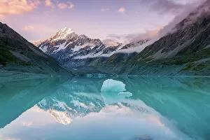 Pink Collection: Mt Cook at sunset reflected in lake, New Zealand