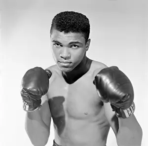 Prints of BRONX, NY - MAY 17: Muhammad Ali, 20 year old heavyweight contender from Louisville, Kentucky poses for the camera on May 17, 1962, in Bronx, New York. (Photo by Stanley Weston/Getty Images) In the Ring: The Art of Boxing: Muhammad Ali