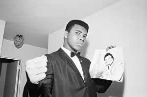 Muhammad Ali with Picture of Opponent