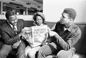 Headline Prints: Muhammad Ali Points to Newspaper