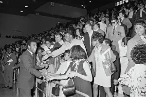 Muhammad Ali Shaking Hands with Students