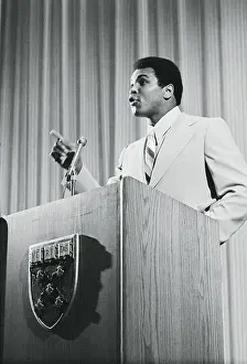 Muhammad Ali Speaking at Podium
