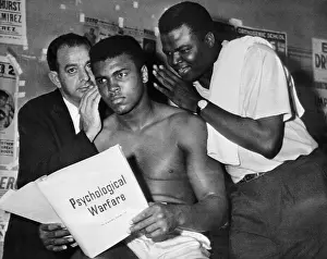 Whispering Prints: Muhammad Ali with his Trainers