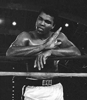 Prints of Close-up of American boxer Muhammad Ali (formerly known as Cassius Clay) as he leans on the ropes during a break in training, 1967. (Photo by Robert Abbott Sengstacke/Getty Images) In the Ring: The Art of Boxing: Muhammad Ali In Training