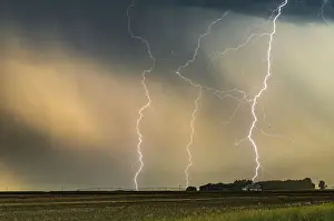 Multiple Lightning strikes hit a ranch in Nebraska at sunset, USA