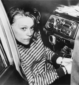 Restrained Prints: Murder Suspect Margo Freshwater in Police Car