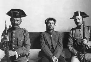 Surrender Prints: Murder Suspect with Spanish Policemen