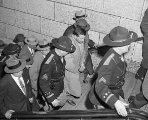 State Trooper Prints: Murderer Mad Dog Irvin Being Transported by Police