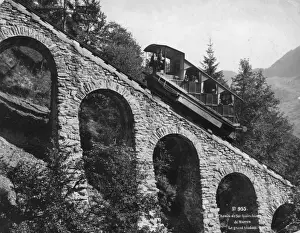 Prints of circa 1890: Passengers travelling up the grand viaduct at Murren, Switzerland on a steep funicular railway. (Photo by Hulton Archive/Getty Images) Viaduct View Prints: Murren Railway