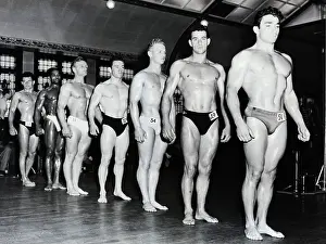 Muscle Men Stand On Line; Mr. Universe