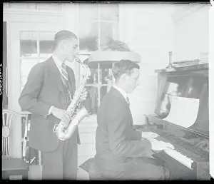 Musician Brothers Playing Their Instruments