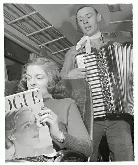Musicians Serenading Girl Reading Fashion Mag