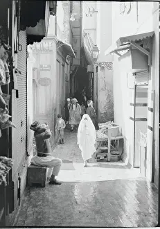 Muslim Woman on Narrow Street